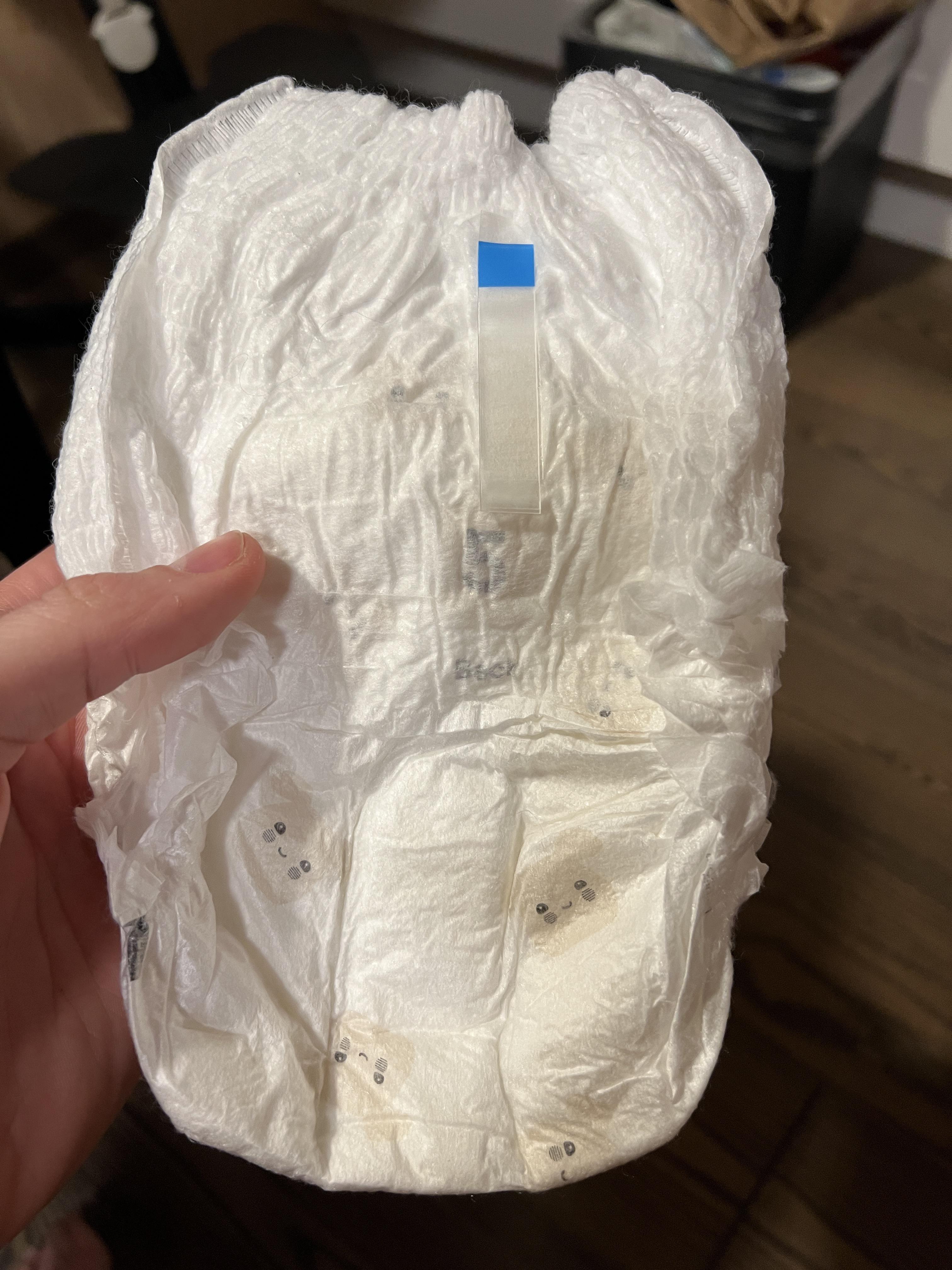 sticky tape on back side of pampers pants